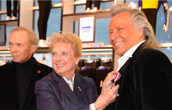 former Lieutenant-Governor Pearl McGonigal and Senator Rod Zimmer presented fashion designer Peter Nygård with the Queen’s Diamond Jubilee Medal.