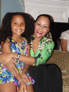 Alejandra Stack gets a hug from the birthday lady, Mrs. Christie