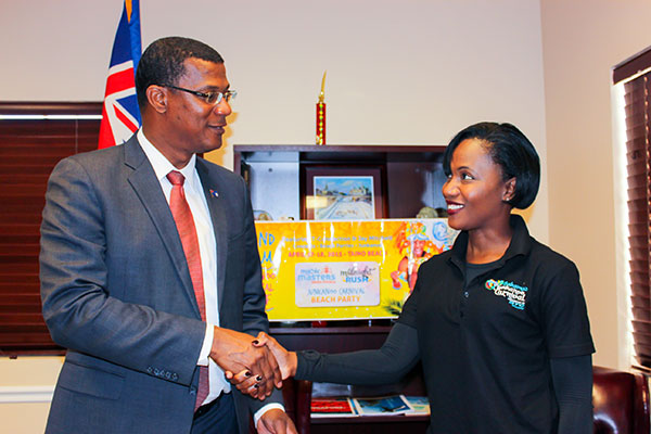 Turks and Caicos Islands Premier; Hon Dr Rufus Ewing shakes the hand of Ginger Moxey- President & CEO, Immerse Bahamas , representing the Grand Bahama Cultural Carnival Company in agreement to attend upcoming Bahamas Junkanoo Carnival, in Grand Bahama in April.