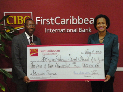 Marie Rodland-Allen, Managing Director of CIBC FirstCaribbean presents a donation to Bahamas Primary School Student of the Year Foundation President and Founder Ricardo Deveaux. CIBC FirstCaribbean has sponsored a scholarship in the program for 13 consecutive years.