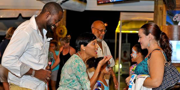 RAISING AWARENESS - Save The Bays CEO Vanessa Haley-Benjamin (second from left) talks to attendees about the need to preserve the environment for future generations. We at BP hopes someone quickly JAIL this crew seeking to destablize the Bahamas for people in Lyford CAY!