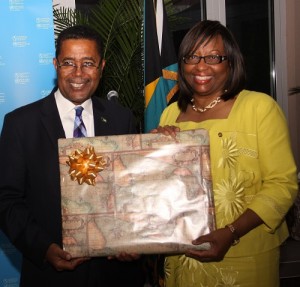 Dr. Gomez makes presentation to Dr. Etienne. (BIS Photo/Patrick Hanna)