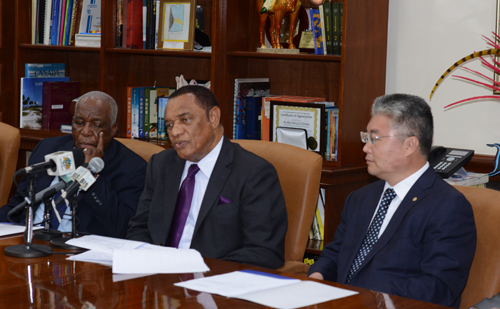Pictured during the signing ceremony at the Office of the Prime Minister on Wednesday, July 29, 2015 are from left: Godfrey Eneas, President of BAMSI; Prime Minister Christie; and Yu Zhigang, President of Ocean University of China. (BIS Photo/Peter Ramsay) 