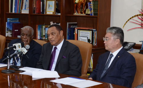 Pictured during the signing ceremony at the Office of the Prime Minister on Wednesday, July 29, 2015 are from left: Godfrey Eneas, President of BAMSI; Prime Minister Christie; and Yu Zhigang, President of Ocean University of China. (BIS Photo/Peter Ramsay)