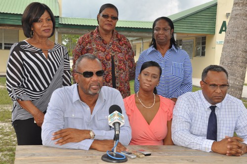 CLASSROOMS READY – Minister of Education Science and Technology the Hon. Jerome Fitzgerald is pictured during a press briefing at the Sir Jack Hayward Junior High School on Friday. He said he was impressed with the work being done in preparation for the 2015/2016 academic year. Left to right seated are: Mr. Fitzgerald; Shennan Rolle, Principal of the Sir Jack Hayward Secondary School and Dr. Michael Darville, Minister for Grand Bahama. Standing left to right are: Dorothy Kemp, District Superintendent for East Grand Bahama; Mary Russell, District Education Officer, East Grand Bahama; and Mary Cooper, District Superintendent, West Grand Bahama. (BIS Photo/Andrew Miller) 