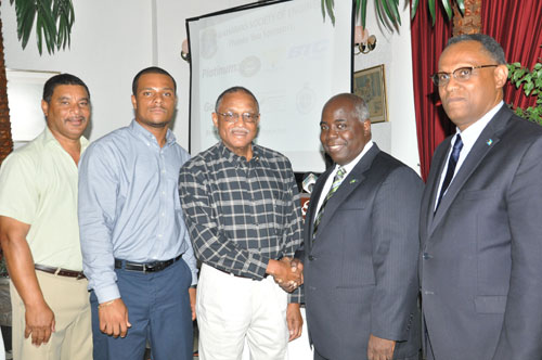 HONOUREE -- The Northern Branch of the Bahamas Society of Engineers on Thursday honoured one of their own -- Paul Lockhart during the 2015 Grand Bahama Annual Meeting and Workshop Luncheon at the Ruby Swiss Restaurant. Shown from left are: Darious Williams, Master of Ceremonies; Remington Wilchcombe, Northern Branch President; Mr. Lockhart; Deputy Prime Minister and Minister of Urban Development, the Hon. Philip Davis, who was the guest speaker for the event; and Minister for Grand Bahama, the Hon. Dr. Michael Darville. (BIS Photo/Andrew Miller) 
