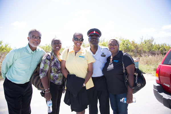 BTC CEO Leon Williams, CMO Janet Johnson, VP of Customer Operations Patricia Walters and VP of Human Resources Valerie Wallace are escorted by a Rum Cay based Royal Bahamas Police Officer on their visit. 