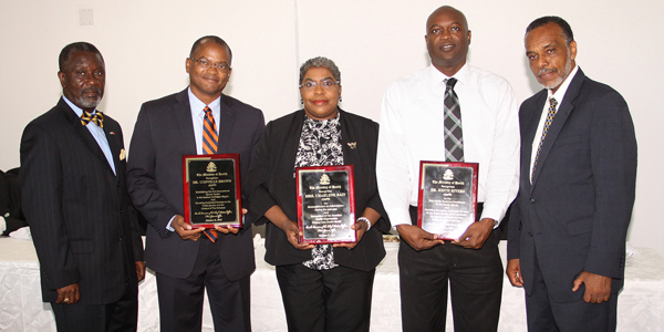 Chief Medical Officer, Dr. Glen Beneby (far right) and Permanent Secretary at the Ministry of Health, Marco Rolle (left) flank the recipients of the first-ever Chief Medical Officer Award for Outstanding Achievement. The initial recipients were (from second left) Dr. Conville Brown (entrepreneurship); Mrs. Charlene Bain (public health administration); and Dr. Keith Rivers, a former lab technician who was the first graduate of the Family Medicine Specialty School to be assigned to a Family Island. (BIS Photo/Patrick Hanna) 