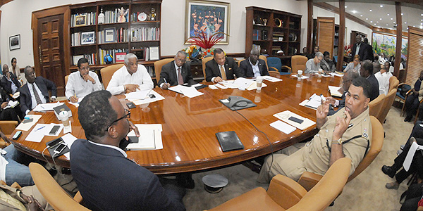 Prime Minister the Rt. Hon. Perry Christie (centre right), with Cabinet Ministers and key Government Agencies, monitors the effects of Category 4 Hurricane Joaquin on the Bahama Islands, and coordinates response at the Office of the Prime Minister on October 2, 2015.  After the all-clear from NEMA, assessment of the aftermath of this very dangerous storm will get underway.  (BIS Photo/Peter Ramsay)