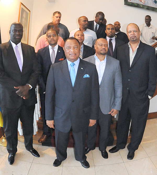 Prime Minister Christie, centre, in group photo with the Gaming House Operators Association during their donation to Hurricane Relief efforts at the Office of the Prime Minister, October 13, 2015. (BIS Photo/Peter Ramsay) 