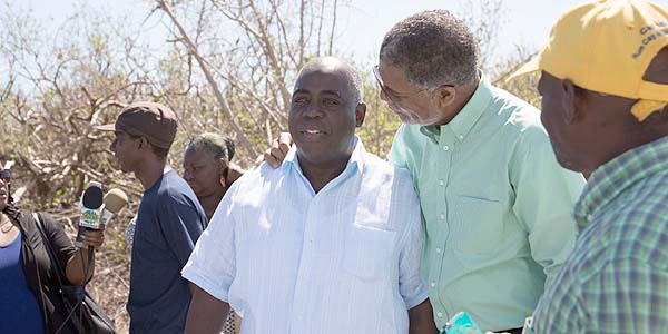 Deputy Prime Minister, The Hon. Philip  E. Brave Davis, joined Mr. Williams to survey restoration progress and the opening of the  temporary school.