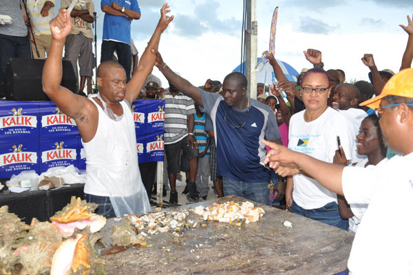 WINNER DECLARED – Joseph Tate is seen being declared the winner of the 43rd annual Conch Cracking Competition on Monday in McLean’s Town. (BIS Photo/Vandyke Hepburn) 