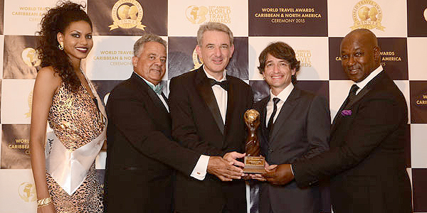 (From left to right: World Travel Awards model, Gary Williams, General Manager of Sandals Royal Bahamian Spa Resort & Offshore Island , Jeremy Mutton, General Manager of Sandals Emerald Baya Spa Golf, Tennis & Spa Resort, Ramel Sobrino, General Manager of Sandals Ochi Beach Resort and David Latchimy, General Manager of Sandals Negril Beach Resort & Spa)