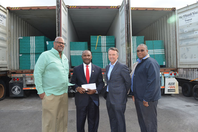 Ed Fields (SVP of Public Affairs and Retails), Paul Burke (President & Managing Director) Craig Tony Gomez (President of the Bahamas Red Cross) Ivan James (VP of Supply Chain Management).