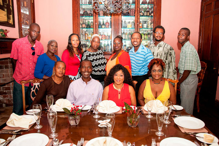 Breaking Bread – Members of Kingdom Mercy Ministry, an organization that prepares some 1,100 meals on a weekly basis were recently hosted to an appreciation luncheon at Graycliff Restaurant. Pictured, seated l-r: Linda Poitier; Philip Smith, founder Kingdom Mercy Ministry and executive director the Bahamas National Feeding Network; Kelly Nixon-Russell and Valene Benjamin. Standing, l-r: Cardinal Butler; Elizabeth Gray; Malissa Clare; Lisa Pugh; Samuel Clarke; Taniko Neymour and Ramon Johnson. Missing from the photo are Roland Solomon; Shawna Johnson-Roker; Shrivon Gay; Judith Hanchell; Oprian King; Ochee Frances; Rocetta Skully; Stafford Bain; Wayne Parish and Leonard Williams. (Photo by Derek Smith Jr.)