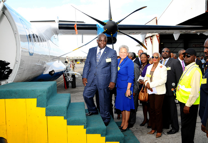 Deputy Prime Minister and Minister of Works and Urban Development Philip Davis and Minister of Transport and Aviation Glenys Hanna-Martin are pictured among other officials near the new Bahamasair aircraft. 