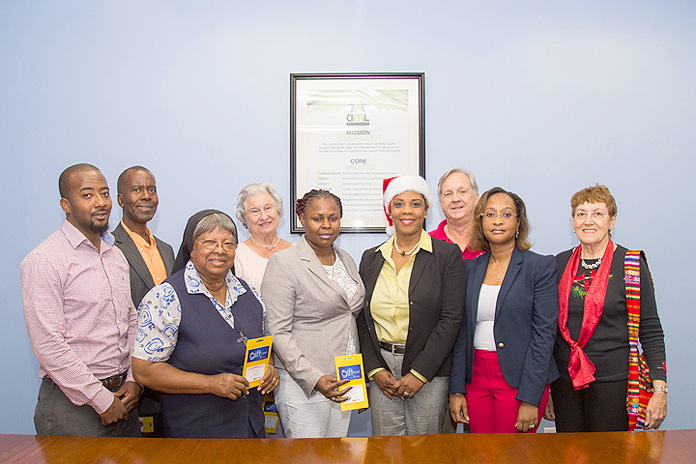 Food brands Solomon’s, Cost Right, Domino’s, Carl’s Jr. and Solomon’s Fresh Market give generous donation to 10 nonprofit groups. Front row, l-r: Sister Cecilia Albury OSB, Director St. Joseph’s Adult Day Care; Olive Major, Administrator Bilney Lane Children’s Home; Brenda Dean, Group Financial Controller AML Foods Ltd.; Renea Bastian, Vice President Marketing & Communications AML Foods Ltd. and Joan Moss, volunteer St. Joseph’s Adult Care; Back row, l-r: Shirlen Godet, Franchise Marketing Manager AML Foods Ltd.; Philip Smith, Executive Director Bahamas National Feeding Network; Judith Higgs, Director Cancer Society of The Bahamas and R.E. Barnes, Chairman Sassoon Heart Foundation