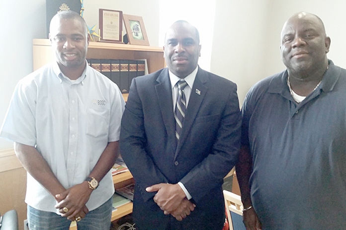 Abaconians are making their roads safe. Bahamas Striping Group of Companies is in Abaco applying thermoplastic beads and cat eyes on all the dangerous curves. Show from left to right: Mr. Atario Mitchell, President of Bahamas Striping Group of Companies, Mr. Renardo Curry, Parliamentary Secretary in the Office of the Prime Minister and Member of Parliament for North Abaco, Mr. Philmore Poitier, Inspector, Ministry of Works.