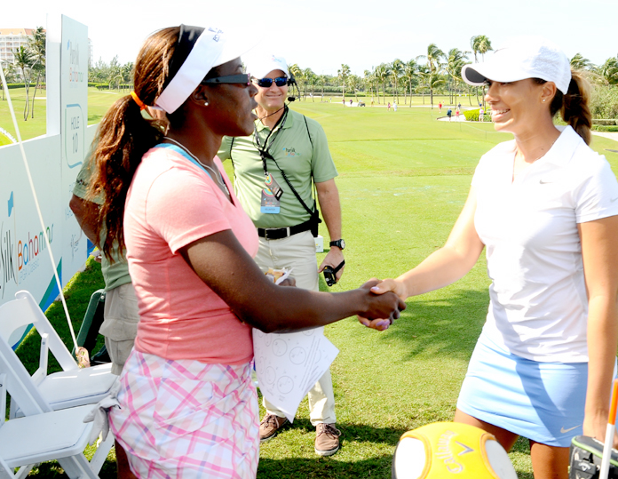 Bahamian golfer Georgette Rolle, left, shakes hands with fellow golfer Cheyenne Woods on Thursday morning, in the qualifying round of the Pure Silk-Bahamas LPGA Classic at the Ocean Club Golf Course, Paradise Island, January 25-31, 2016.  (BIS Photo/Kemuel Stubbs)