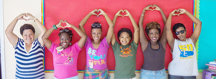 Principal of Morrisville Primary School, Ms. Suzan Cartwright, Noelle Khalila and the traveling crew who visited the school as a part of their Harambee Bahamas Weekend.