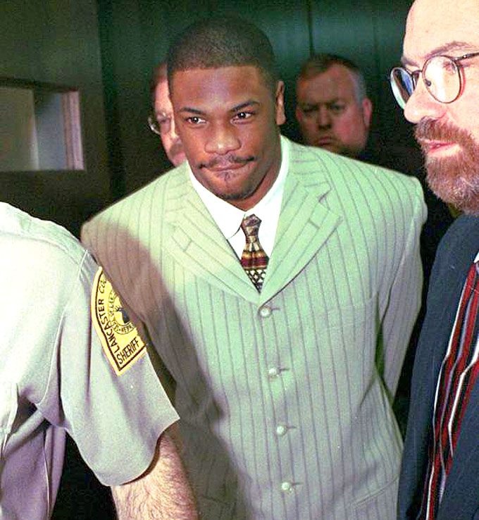 Lawrence Phillips leaves Lancaster County Court in Lincoln, Neb., in 1997 to begin a 30-day sentence for a probation violation. Dennis Grundman / AP