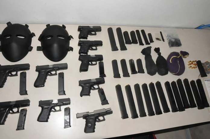 Deadly weapons seized by police from four suspects on Grand Bahama Saturday! Criminals only need rocket launchers and we could be named a Terrorist Cell State!