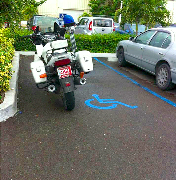 Police motorcyclist with no respect for the disable! WHAT IS THIS?