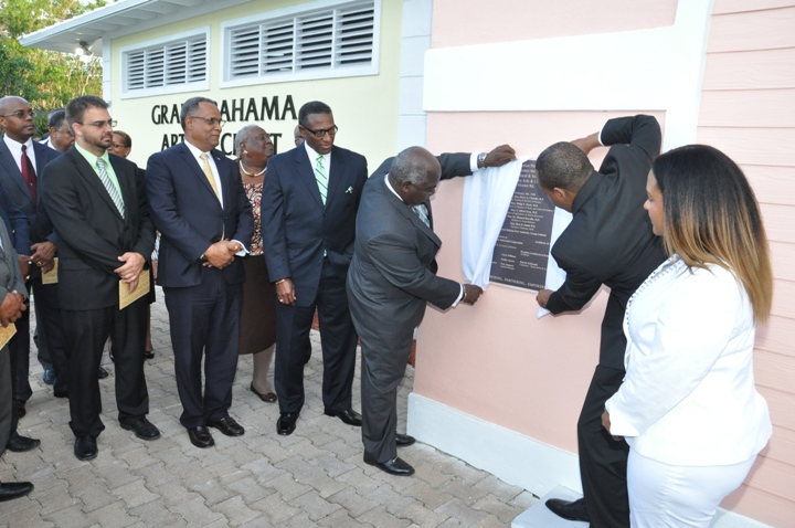 PLAQUE UNVEILING – Deputy Prime Minister and Minister of Works and Urban Development, the Hon. Philip Davis teams with the Hon. Dion D. Smith, Deputy Speaker of the House of Assembly and Executive Chairman of BAIC as they unveil the plaque marking the official opening of the Grand Bahama Arts and Craft Centre, Thursday. Left to right are: Clay Sweeting, Deputy Chairman, BAIC; Dr. the Hon. Michael Darville, Minister for Grand Bahama; the Hon. V. Alfred Gray, Minister of Agriculture and Marine Resources; DPM Davis; Mr. Smith; and Chala Cartwright, Assistant General Manager BAIC (Northern Region). (BIS photo/Vandyke Hepburn)