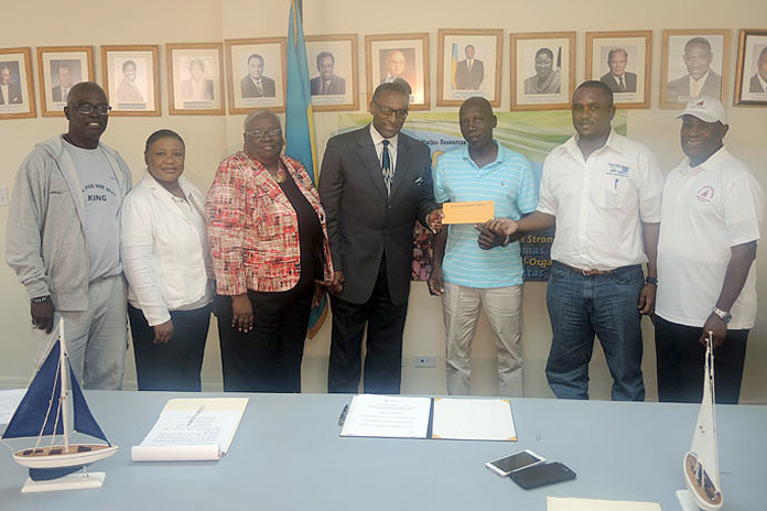 From left at the announcement and check presentation ceremony: Dr. Philip McPhee, Regatta Consultant, Ministry of Agriculture; Cephas Cooper, Under Secretary, Ministry in the Ministry of Agriculture; Cindy Gay, Regatta Desk Representative; Rena Glinton, Permanent Secretary, Ministry of Agriculture; Minister Gray and two representatives from the regatta association in Farmers Cay, Exuma; and to the far right, Daniel Strachan, Commodore of the Family Island Regatta Committee. The check presentation and announcement of the Sir Durward Knowles National Junior Regatta was held at the Ministry of Agriculture, Friday, 29th January 2016. 