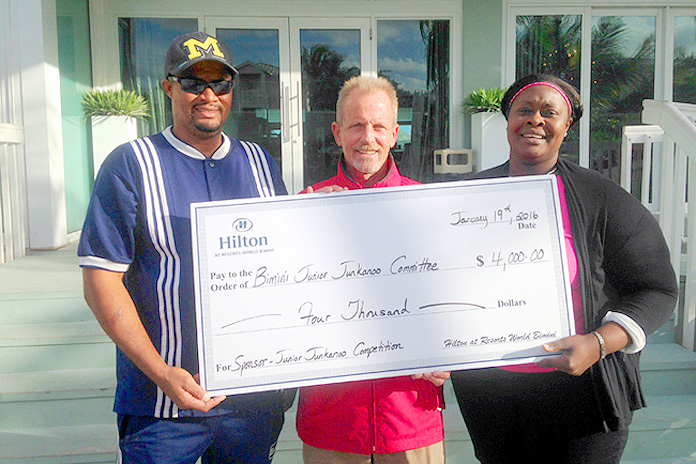 Bimini Junkanoo Committee receive a cheque following their victory.