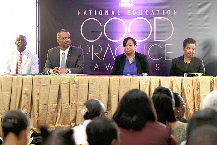 The Minister of Education, Science and Technology the Hon. Jerome Fitzgerald is shown (second left) at the launch of the National Education Good Practice Awards. Also pictured from left are Lionel Sands, Director; Donella Bodie, Permanent Secretary and Dr. Pandora Johnson. 