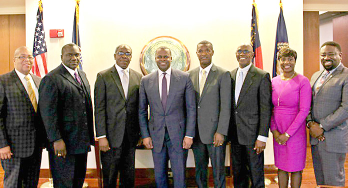 During a courtesy call on Atlanta Mayor Kaseem Reed, pictured from left to right: Pastor Dale Moss, Church of God of Prophesy; Rev. Delton Fernander, Pastor, New Destiny Baptist Church; Pastor Deanza Cunningham (Non-Denominational); Mayor Reed; Rev Randford Patterson, Pastor of A.M.E. Zion and President of the Bahamas Christian Council; Father James Palacios; Mrs Monique Major Vanderpool, Deputy Consul General; and Mr.Robert Pinder, Cultural & Student Relations Attache.