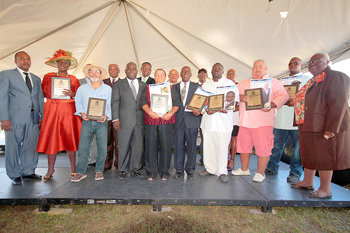 Cabinet Ministers and Members of Parliament with Bahamians recognized as outstanding farmers, during the opening ceremony for The Bahamas National Agricultural Marine Resources and Agri-Business Expo 2016, on March 10, 2016, at the Gladstone Road Agricultural Centre. (BIS Photo/Eric Rose)