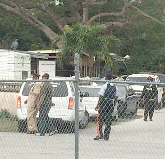 Police outside the home on Grand Bahama following a double homicide this morning.