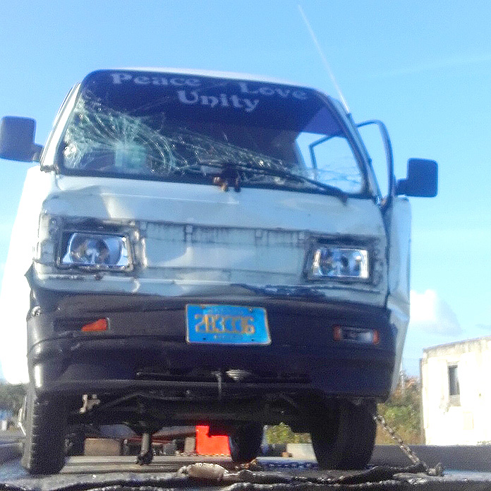 Company van collide with truck.