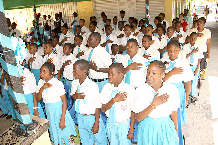 Students are shown reciting the nation’s Pledge of Allegiance. BIS Photo/Patrick Hanna