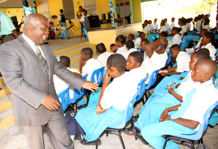 The Hon. Philip Davis, Deputy Prime Minister and Minister of Works and Urban Development, is shown greeting students of South Andros High school. BIS Photo/Patrick Hanna