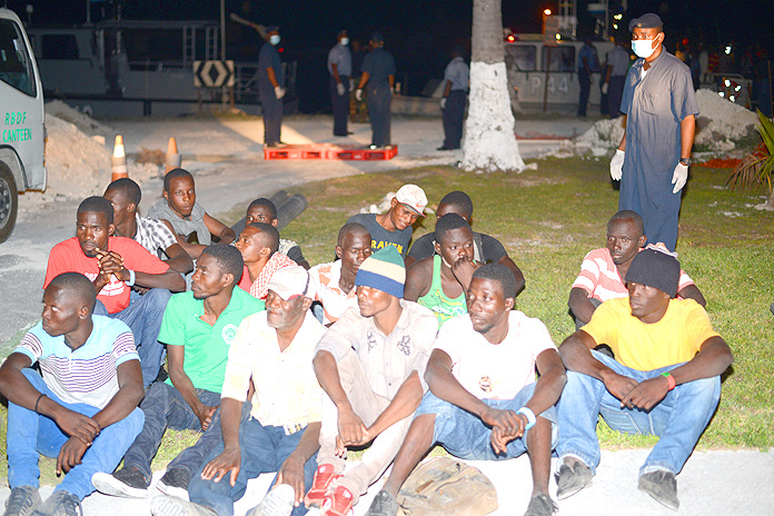 Migrants awaiting processing onboard HMBS Coral Harbour (Photo: Marine Seaman Stefan McDonald)