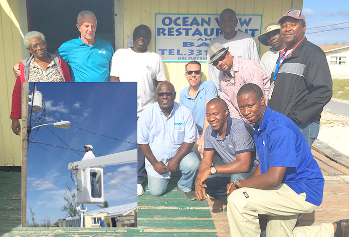 Business owner Trevellyn Bain welcomes the BTC Team with a “thumbs up” as they prepare to install FLOW TV at the Ocean View Restaurant and Bar. BTC has been working tirelessly to repair damage from Hurricane Joaquin and to prepare Rum Cay for FTTH and FLOW TV.  
