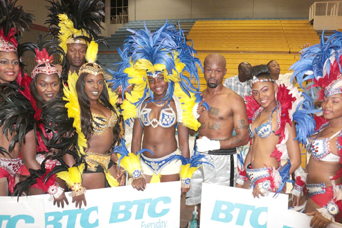 Boxer Meacher ‘Major Pain’ Major flanked by Carnival Dolls at the Caribbean Showdown boxing event in Nassau.