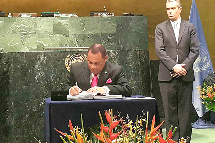 Prime Minister Christie signs historic Climate Change Agreement at the United Nations. 