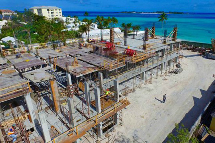 Local contractors and more than 150 Bahamian workers are on site at ONE Cable Beach, a luxury condo project by Aristo Development just west of Melia Nassau Beach Resort, West Bay Street. Bahamian subcontractors on the $70 million development include Mosko/Bahamas Marine and Greyco Limited. This March 14th aerial view of the $70 million ONE Cable Beach luxury condominium project shows multi-million dollar construction activity including the concrete pour of the third floor.