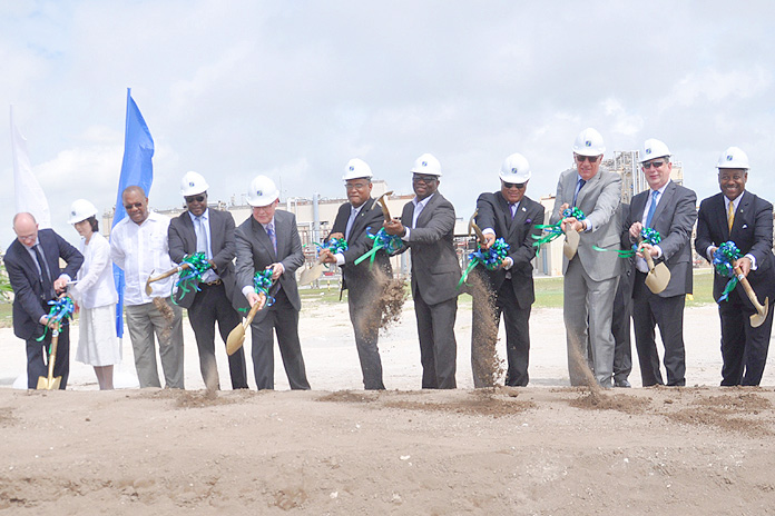 PHARMACHEM EXPANSION – Prime Minister the Rt. Hon. Perry G. Christie was in Grand Bahama Thursday for ground breaking of Pharmachem’s Manufacturing Plant #3. Pictured left to right are: Robin Nicol, V.P Gilead; Taiyin Yang, Gilead; Neko C. Grant, Member of Parliament, Central Grand Bahama; Hon. Khaalis Rolle, Minister of State for Investment; Dr. Regan Shae, Gilead; Hon. Dr. Michael Darville, Minister for Grand Bahama; Randy Thompson, CEO Pharmachem; Prime Minister Christie; Pietro Stefanutti, President, Pharmachem; John Martin, Executive Chairman of Gilead Sciences Inc.; Hon. Obediah H. Wilchcombe, Minister of Tourism; and Clifford Samuel, Gilead.  (BIS Photo/Vandyke Hepburn)