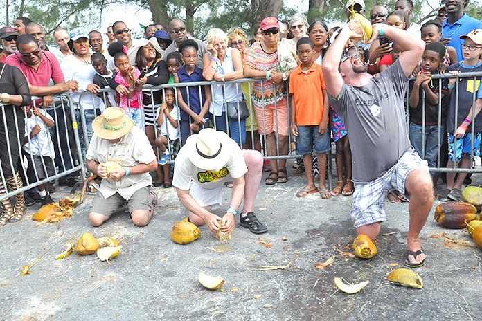 Visitors Joined In -- Coconut Barking Competition at the 18th Annual Pelican Point Coconut Festival held March 28 in Pelican Point, Grand Bahama. (BIS Photo)