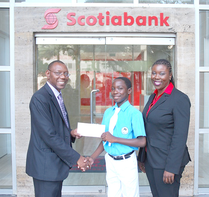 Mr. Ricardo Deveaux, Aquinas College student Dariq Chase and Maxine Seymour from Scotia Bank.