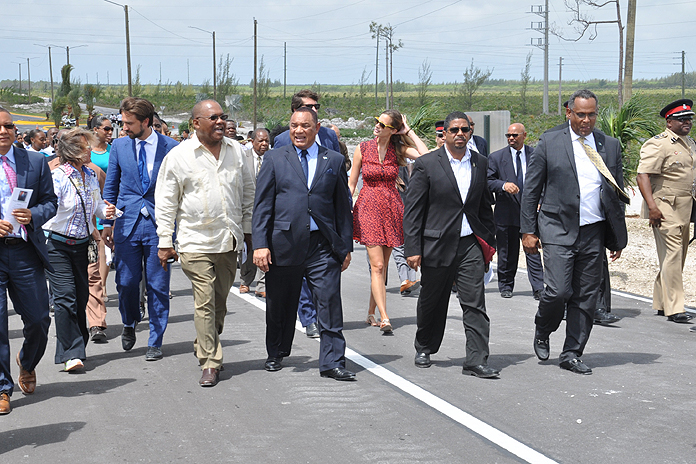 WALKING THE BRIDGE - Following the opening ceremony of the Sir Jack Hayward Bridge, the Prime Minister of The Bahamas, the Rt. Hon. Perry G. Christie (centre); Minister for Grand Bahama, the Hon. Dr. Michael Darville (right); the Hon. K. Peter Turnquest, Deputy Leader of the Free National Movement and Member of Parliament for East Grand Bahama (on Prime Minister’s left); the Hon. Neko Grant, Member of Parliament for Central Grand Bahama (on Prime Minister’s right), along with Hayward and St. George families, walked to the top of the bridge to participate in the unveiling of the plaque and the ribbon cutting. (BIS Photo/Vandyke Hepburn)