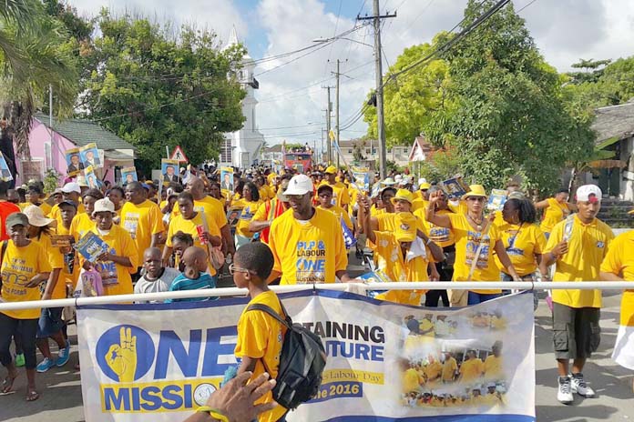 GOLD RUSH! Thousands of PLP supporters marched with labour on Friday.