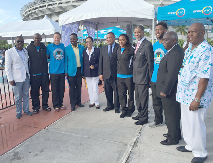 Group Photo including CISC Participants, The Hon. Daniel Johnson M.P., Her Excellency, Dame Marguerite Pindling, The. Rt. Hon. Perry G. Christie, Prime Minister, Arianna Vanderpool-Wallace, BTC Endorsed Athlete, Leon Williams, CEO, The Hon. Philip Davis, Deputy Prime Minister, Algernon Cargill, Bahamas Swim Federation 