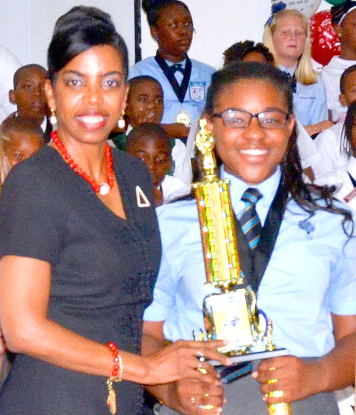 Ms. Myra Mitchell, BTC Project Management Office and BTC scholarship recipient, Ms. Latajha Beneby, first runner up, Bahamas Primary School Student of The Year.