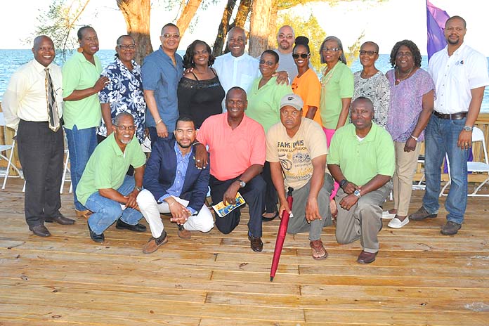 SOME OF THE BAHAMIAN INVESTORS - During the Blessing of the Grounds for Pirate's Cove, the newest tourist attraction in Grand Bahama, a number of the Bahamian investors are seen with Tourism Minister, the Hon. Obie Wilchcombe (standing centre), and President of Arawak Adventure and Commercial Tours Co. Ltd., David Wallace (kneeling in pink shirt). Also shown are Grand Bahama Port Authority President, Ian Rolle (standing fourth from left); Derek Newbold, Business Development Manager, GBPA (far right).  (BIS Photo/Vandyke Hebpurn)  